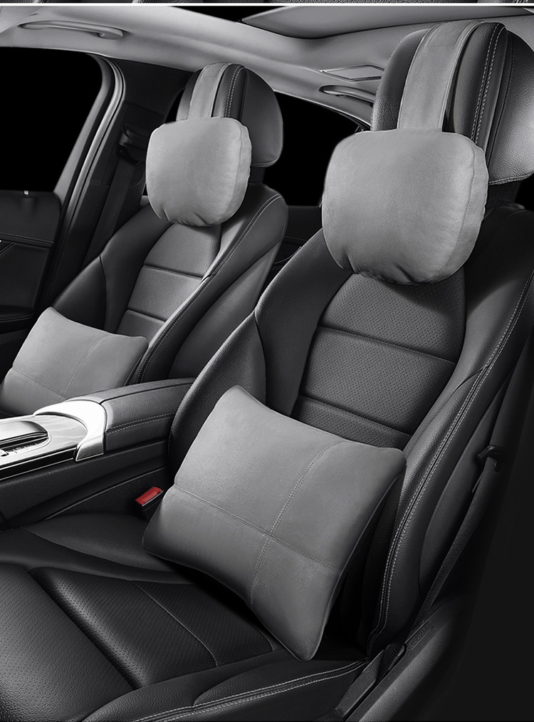 Gray headrest and lumbar cushion installed in a car